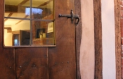 Internal antique oak door with a large leaded window