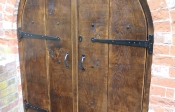 Antique arched double opening external oak door