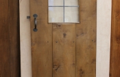 Internal antique oak door with a large leaded window