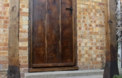 7. Walnut Antique Solid oak door with windows and studs £700.00+vat Frame £375+vat 27mm planks and 32mm ledges. Picture No 8 showing back of the door. Door (no window) with planted on frame at the back £650+vat.